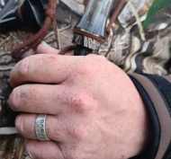Sterling silver duck band wedding ring worn on hand