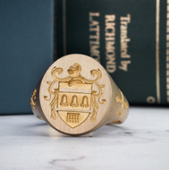 Custom men’s family crest signet ring front view in 14K gold