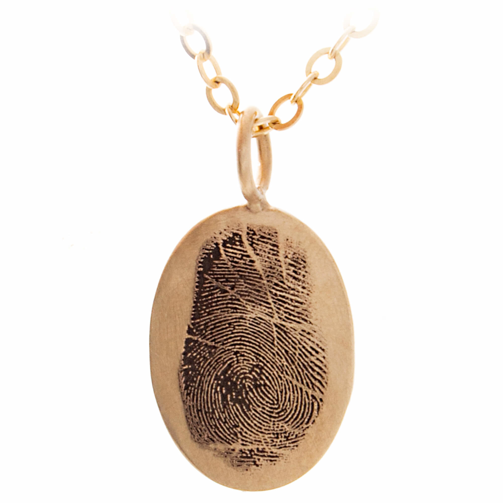 Fingerprint memorial jewelry engraved on a solid gold pendant